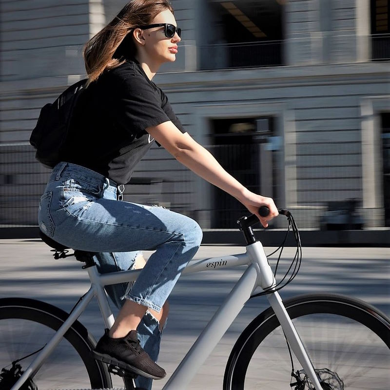Woman on E-bike in Amsterdam